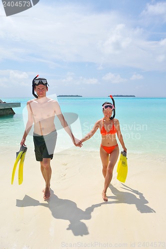 Image of happy young couple have fun on beach