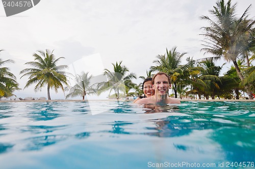 Image of happy young couple relax and take fresh drink