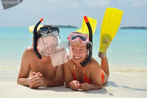 Image of happy young couple have fun on beach