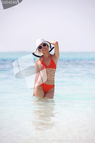 Image of beautiful girl on beach have fun