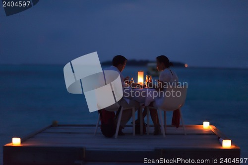 Image of romantic couple have outdoor dinner