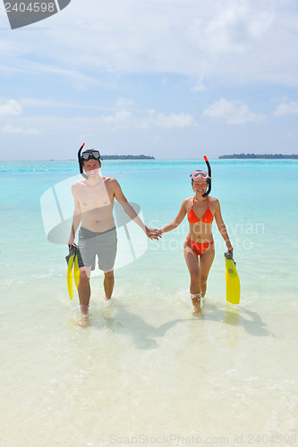 Image of happy young couple have fun on beach