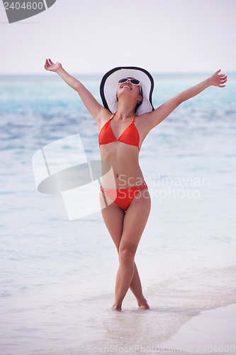 Image of beautiful girl on beach have fun