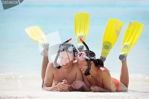 Image of happy young couple have fun on beach