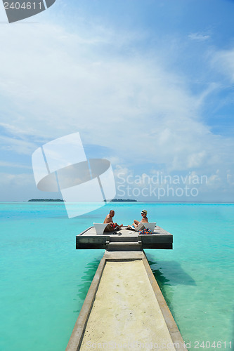 Image of happy young couple have fun on beach