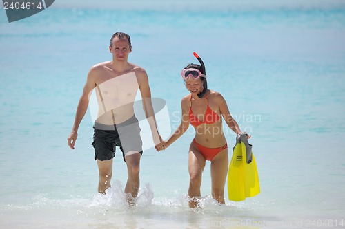 Image of happy young couple have fun on beach