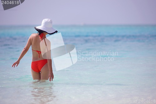 Image of beautiful girl on beach have fun
