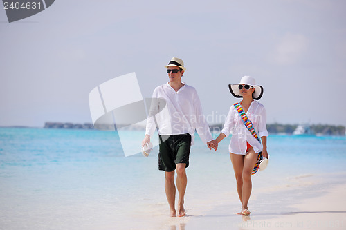 Image of happy young couple have fun on beach