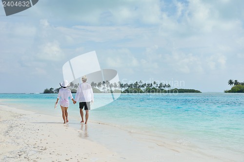 Image of happy young couple have fun on beach