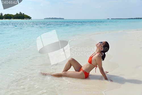 Image of beautiful girl on beach have fun