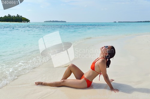 Image of beautiful girl on beach have fun