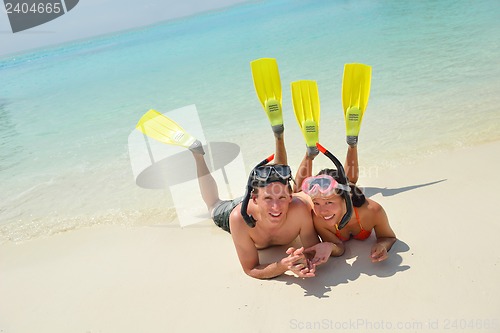 Image of happy young couple have fun on beach