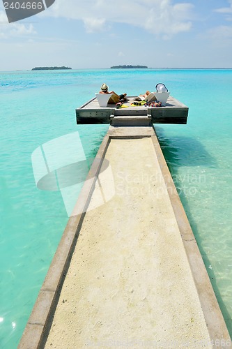 Image of happy young couple have fun on beach
