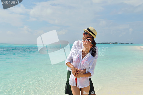Image of happy young couple have fun on beach