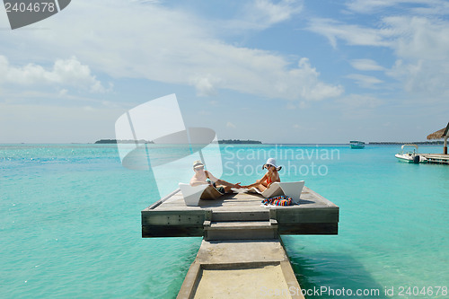 Image of happy young couple have fun on beach