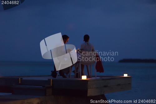 Image of romantic couple have outdoor dinner