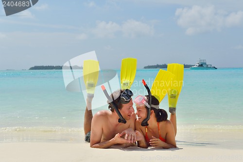 Image of happy young couple have fun on beach