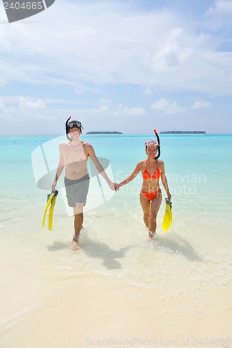 Image of happy young couple have fun on beach