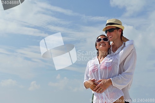 Image of happy young couple have fun on beach