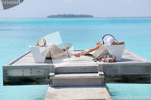 Image of happy young couple have fun on beach