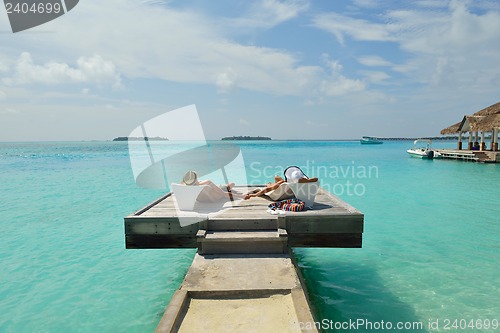 Image of happy young couple have fun on beach