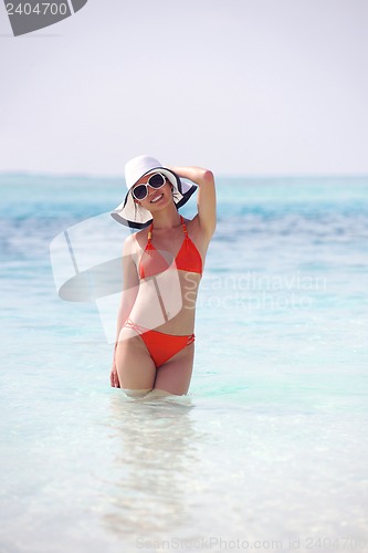 Image of beautiful girl on beach have fun