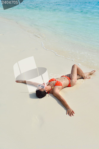 Image of beautiful girl on beach have fun
