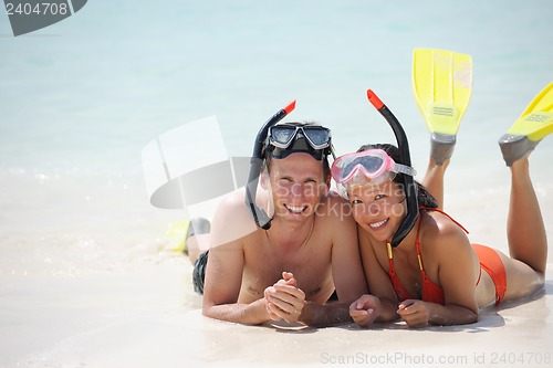 Image of happy young couple have fun on beach