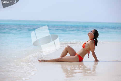 Image of beautiful girl on beach have fun