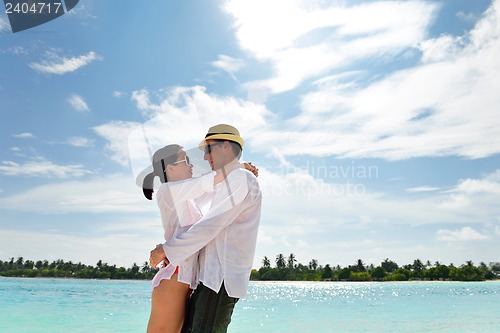 Image of happy young couple have fun on beach