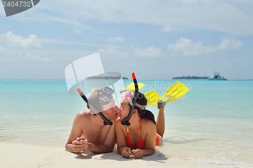 Image of happy young couple have fun on beach