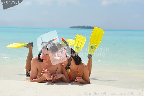 Image of happy young couple have fun on beach