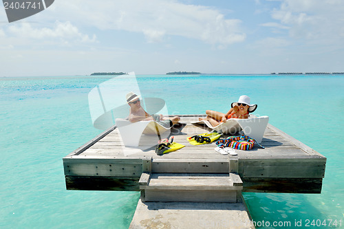 Image of happy young couple have fun on beach