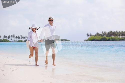 Image of happy young couple have fun on beach
