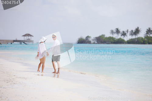 Image of happy young couple have fun on beach