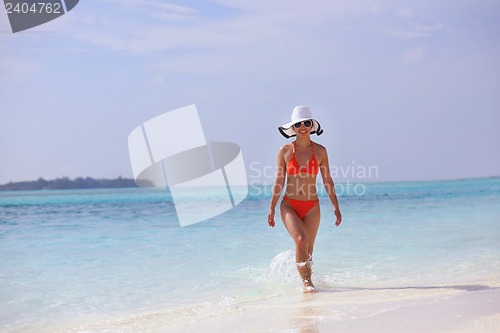 Image of beautiful girl on beach have fun