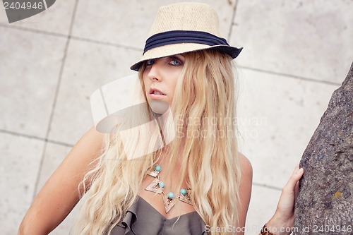 Image of happy young blonde woman with hat outdoor summertime