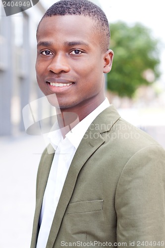 Image of young successful african business man outdoor in summer