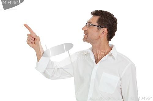 Image of adult attractive smiling man pointing his finger on the copyspace