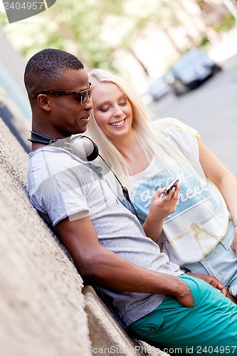 Image of happy young couple have fun in the city summertime 