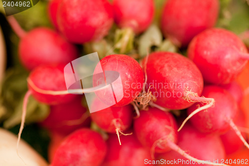 Image of fresh red raddisch closeup macro outdoor market