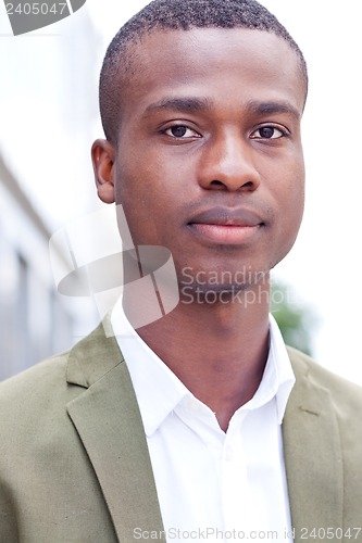 Image of young successful african business man outdoor in summer