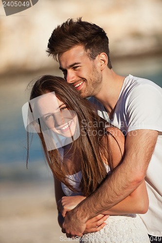 Image of attractive young couple in love having fun in summer holidays