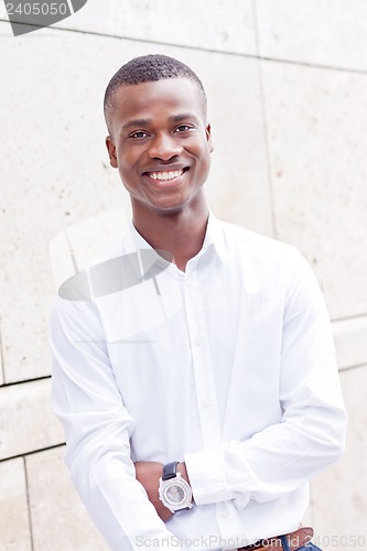 Image of young successfil african businessman with mobilephone 