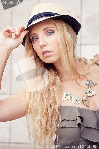 Image of happy young blonde woman with hat outdoor summertime