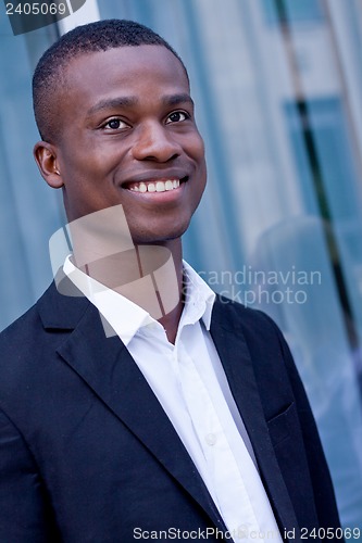 Image of young successful african business man outdoor in summer