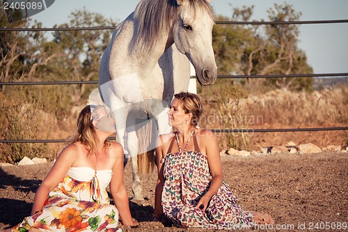 Image of two woman horse and dog outdoor in summer happy