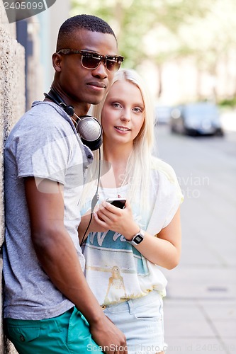 Image of happy young couple have fun in the city summertime 