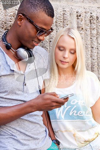 Image of happy young couple have fun in the city summertime 