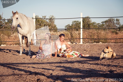 Image of two woman horse and dog outdoor in summer happy